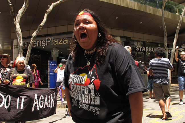 Aboriginal and Torres Strait Islander activists march through the Brisbane business district in the running up to the G20 to protest governmental indigenous policies. Brisbane, Australia 10/11/14