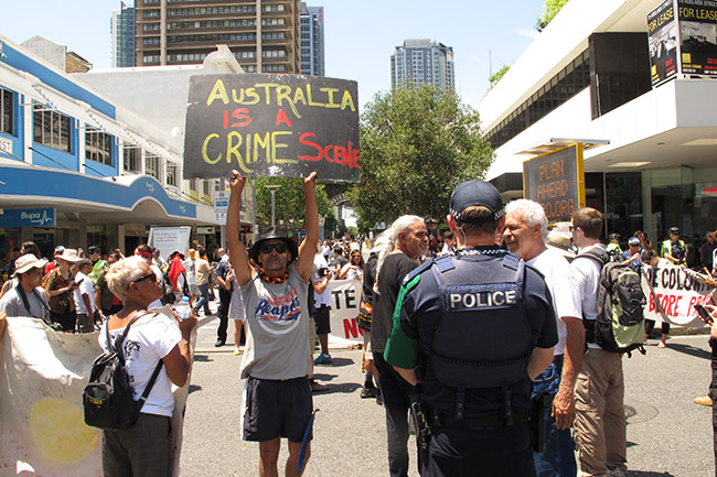 Aboriginal and Torres Strait Islander activists march through the Brisbane business district in the running up to the G20 to protest governmental indigenous policies. Brisbane, Australia 11/11/14