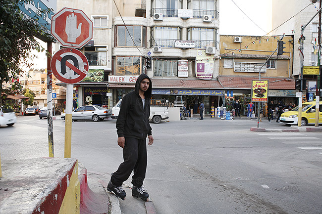 Youths on skates are still a rare sight in the Qalqiliya. Mohammed with his inline skates. Qalqilya, Palestine