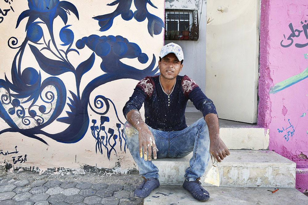 Hamada Dere, 22, from Sheikh Adwan, is an artist taking part in the Al Shati refugee camp make-over. Showing photos of his paintings on his mobile phone he said proudly: "Everyone in my family draws, my brothers and my sisters, my brother was even selected in a talent show." Al Shati, Gaza